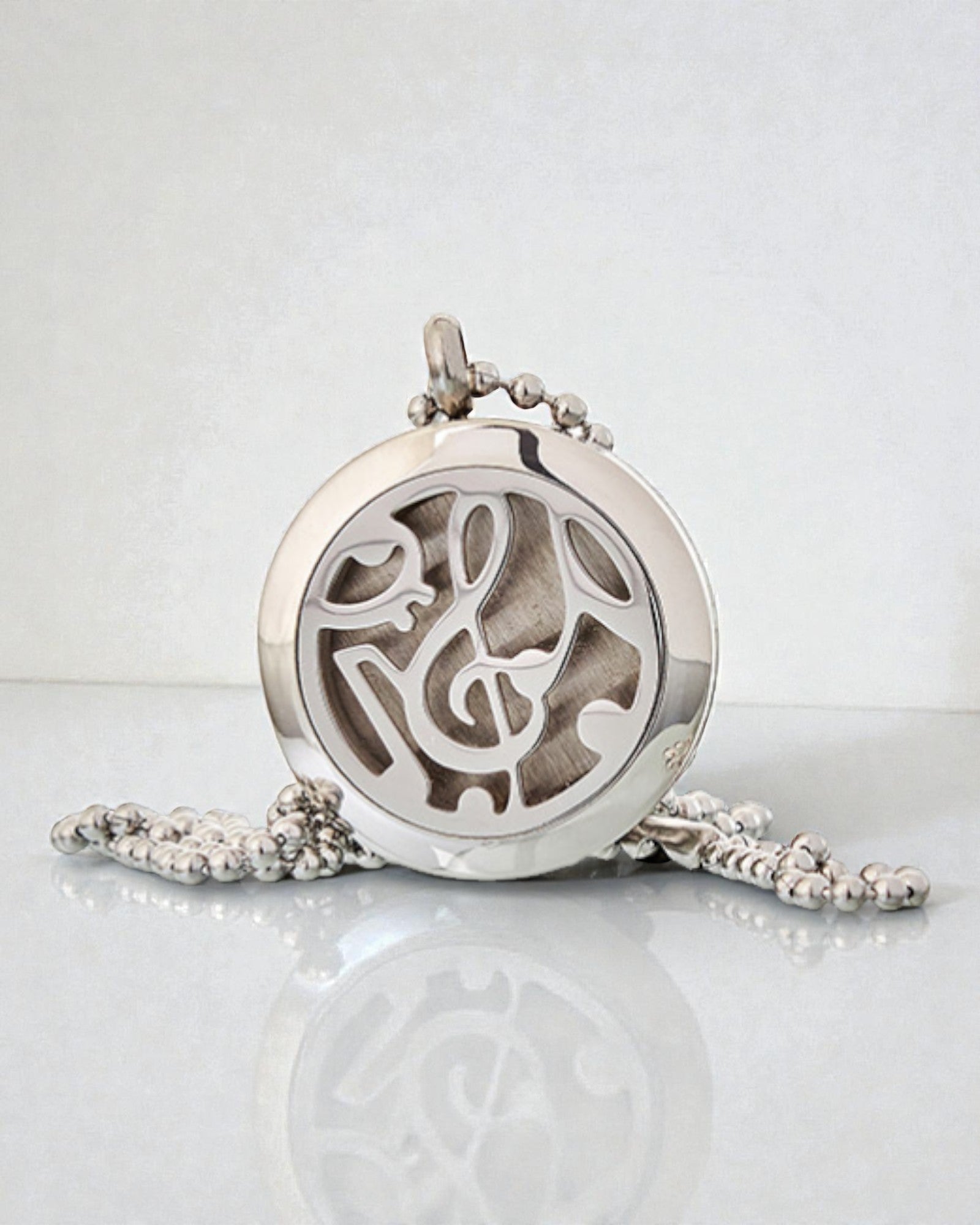Sinfonia do Aroma – Colar de Aromaterapia com Motivo de Notas Musicais 25 mm